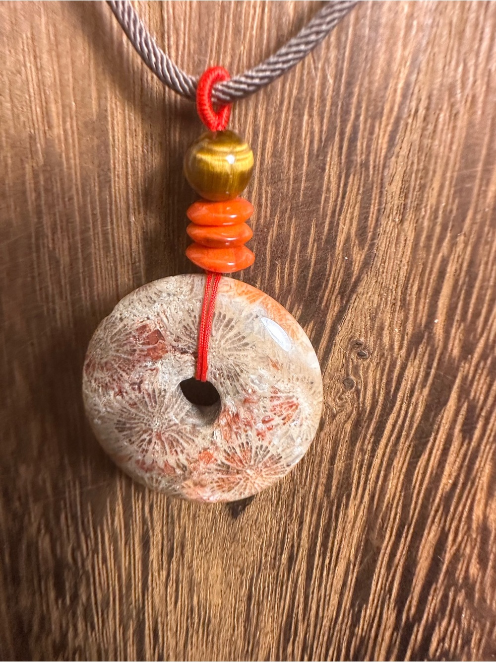 Handcrafted Red and Brown Coral Fossil Donut Pendant Necklace on Brown Rope - Picture 10 of 16